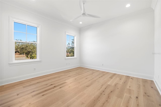 unfurnished room with ornamental molding, light hardwood / wood-style floors, and plenty of natural light