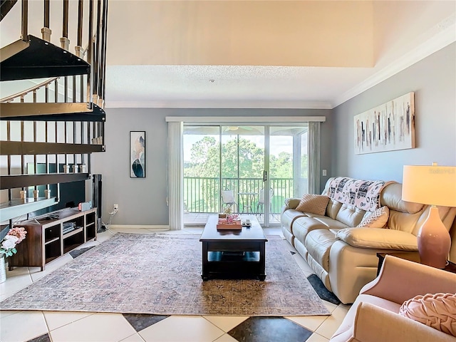 living room featuring light tile patterned floors and crown molding