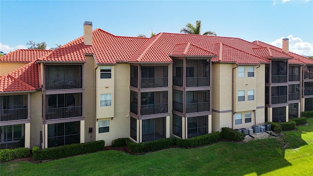 view of building exterior featuring central AC unit