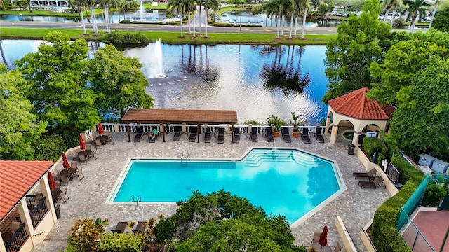 view of swimming pool with a water view