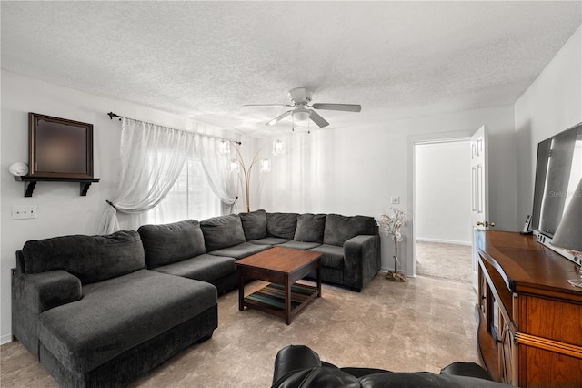 living room with a textured ceiling and ceiling fan