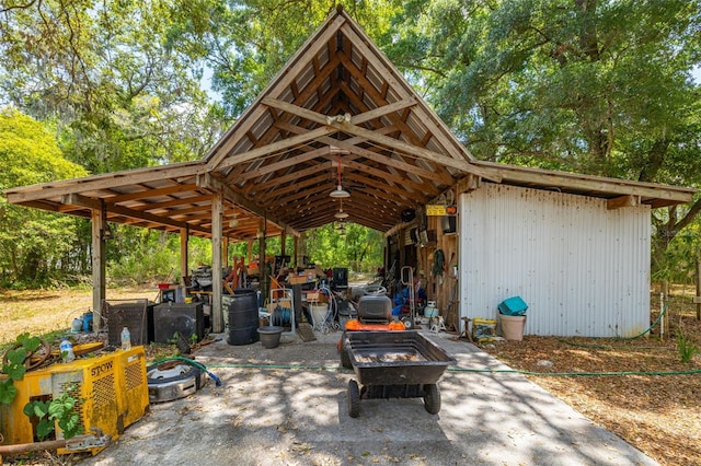 view of home's community featuring an outbuilding and an outdoor fire pit