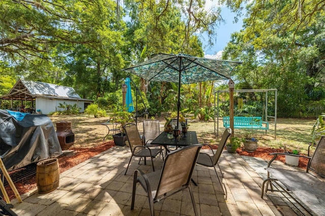 view of patio / terrace with an outdoor structure