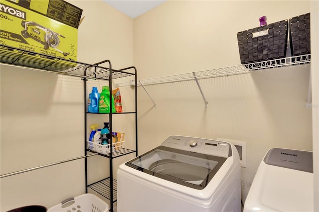 washroom featuring washing machine and dryer