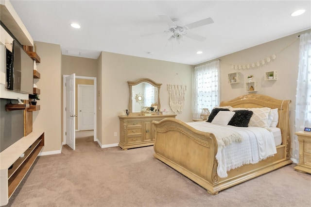 bedroom featuring light carpet and ceiling fan