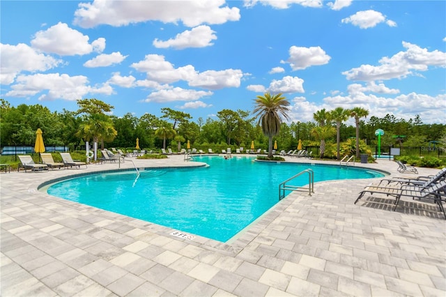 view of swimming pool featuring a patio area