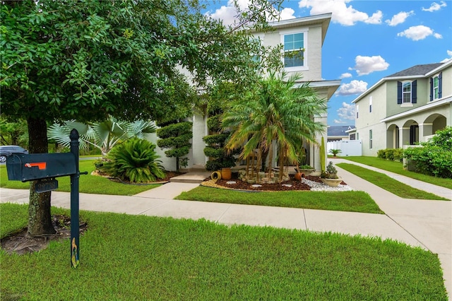 view of front of home featuring a front lawn