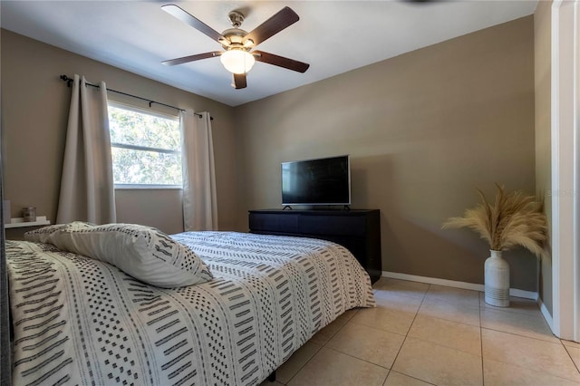 tiled bedroom with ceiling fan