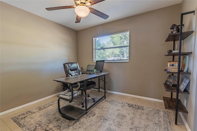 office area with ceiling fan and light tile patterned floors