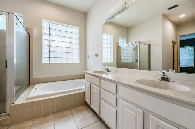 bathroom with a healthy amount of sunlight and plus walk in shower