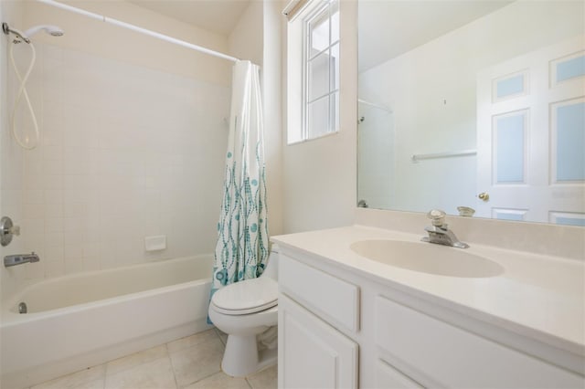 full bathroom with tile patterned flooring, shower / bath combo, vanity, and toilet