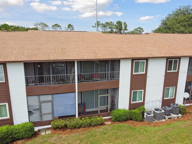 view of building exterior with central AC