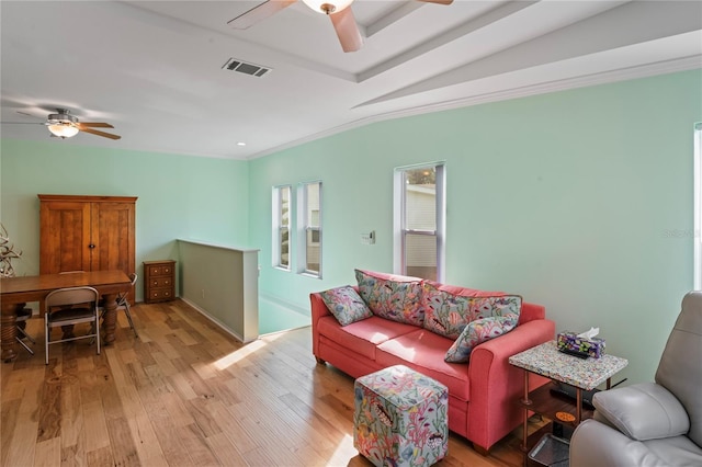 living room featuring light hardwood / wood-style floors and ornamental molding