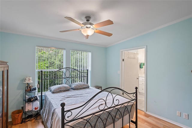 bedroom with ceiling fan, crown molding, ensuite bathroom, and light wood-type flooring