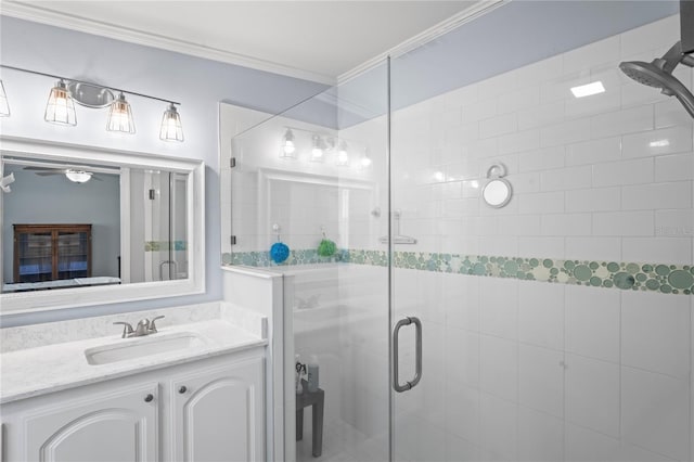 bathroom featuring crown molding, a shower with door, and vanity