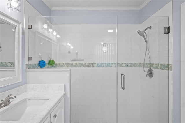 bathroom with vanity, ornamental molding, and a shower with door