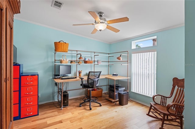 home office with hardwood / wood-style floors, ceiling fan, and ornamental molding