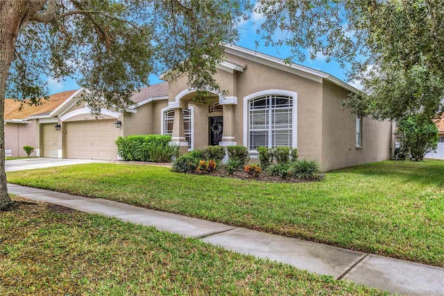 view of front facade featuring a front yard and a garage