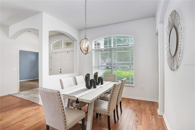 dining area with hardwood / wood-style flooring