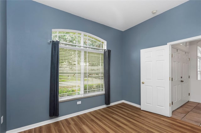 spare room featuring hardwood / wood-style flooring