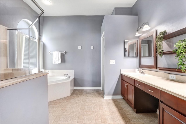 bathroom with tile patterned flooring, vanity, and independent shower and bath