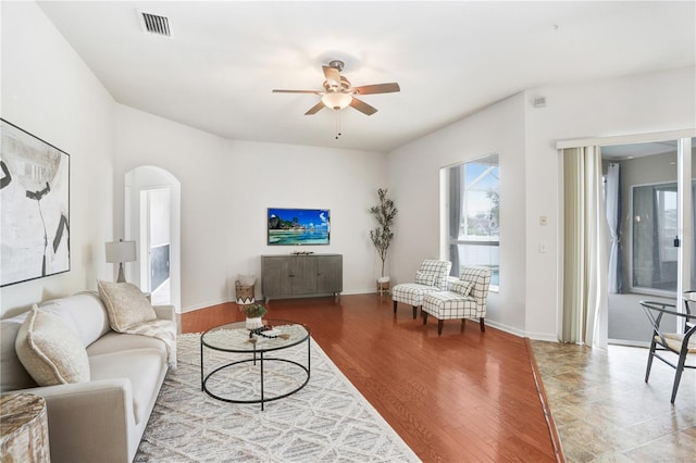 living room with ceiling fan and hardwood / wood-style flooring