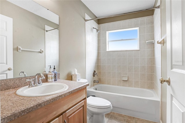 full bathroom with vanity, toilet, and tiled shower / bath