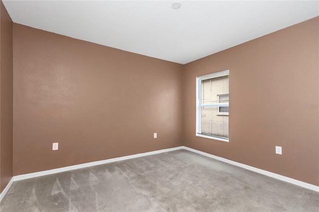 spare room with light colored carpet