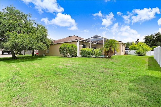 view of yard featuring a lanai