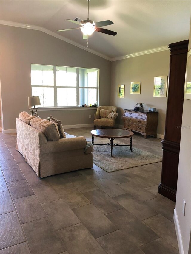 living room with ceiling fan, ornamental molding, baseboards, and lofted ceiling