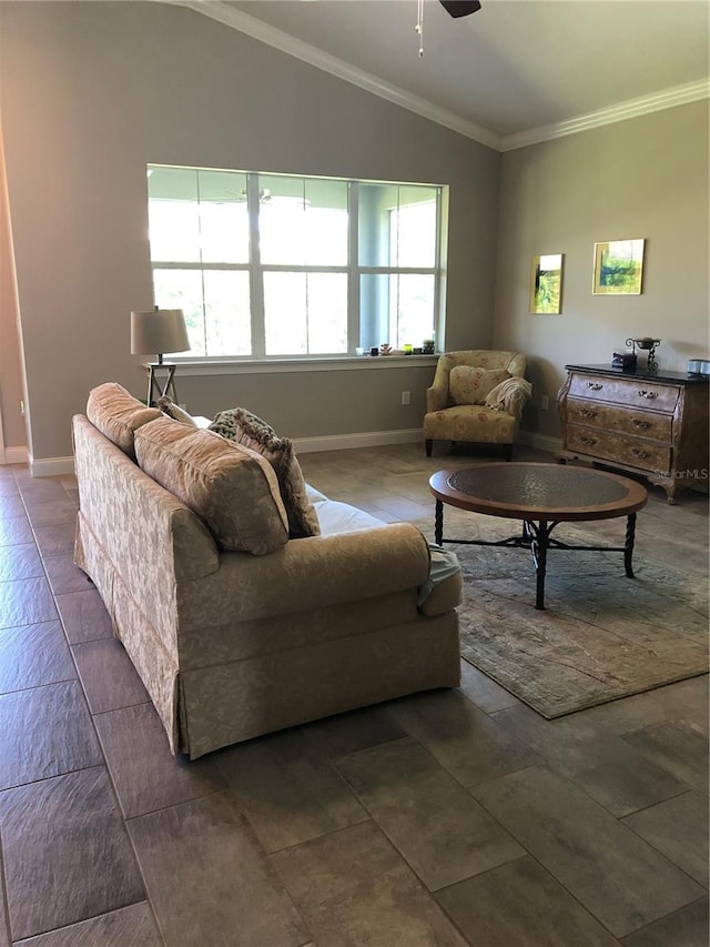 living area with baseboards, ornamental molding, ceiling fan, and lofted ceiling