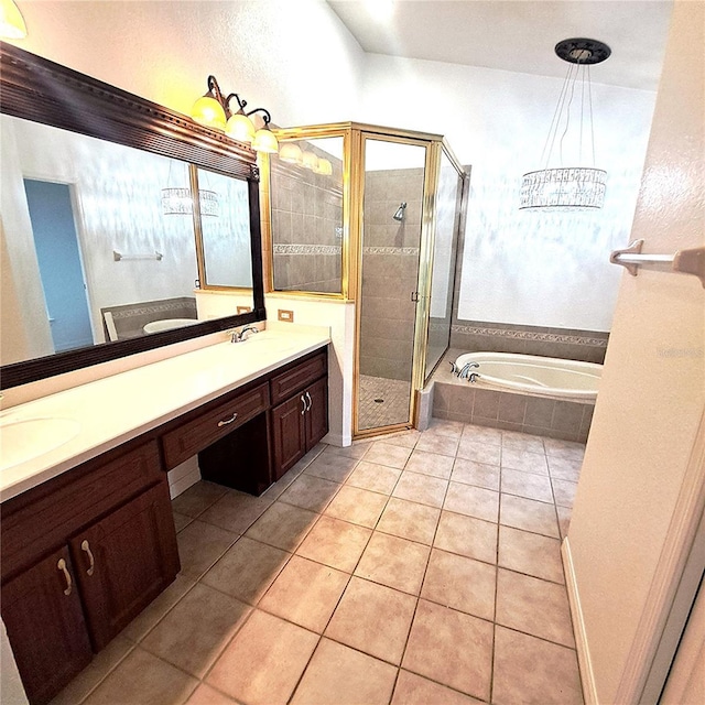 bathroom with vanity, tile patterned floors, and shower with separate bathtub