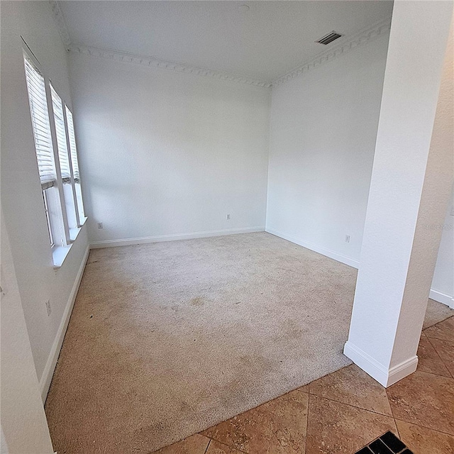 unfurnished room featuring carpet