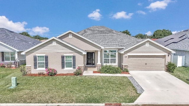 view of front facade with a garage and a front yard