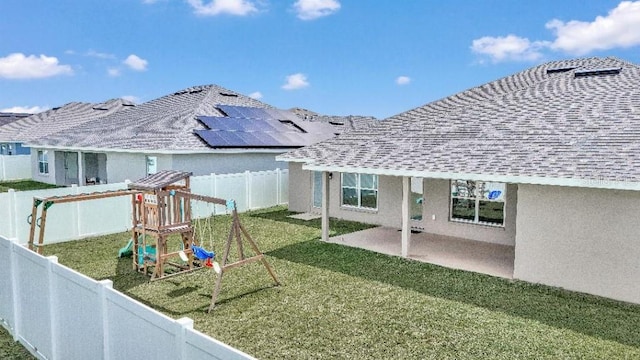 exterior space with a playground and a patio