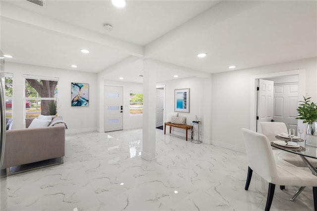 living room featuring beam ceiling