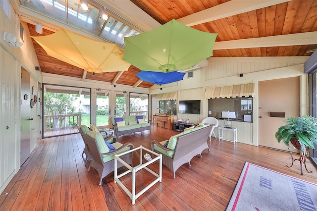 living room featuring wood ceiling, vaulted ceiling with beams, and hardwood / wood-style flooring