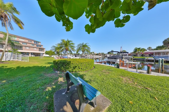 exterior space with a water view and a dock