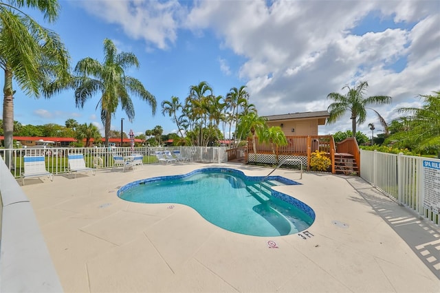 view of pool with a deck and a patio area