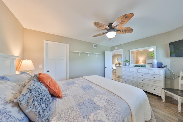 bedroom featuring ceiling fan and hardwood / wood-style floors