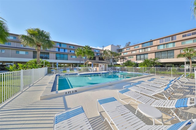 view of swimming pool with a patio