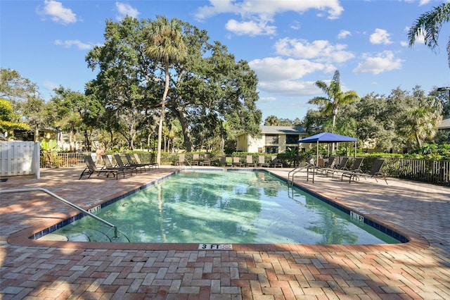 view of swimming pool featuring a patio area