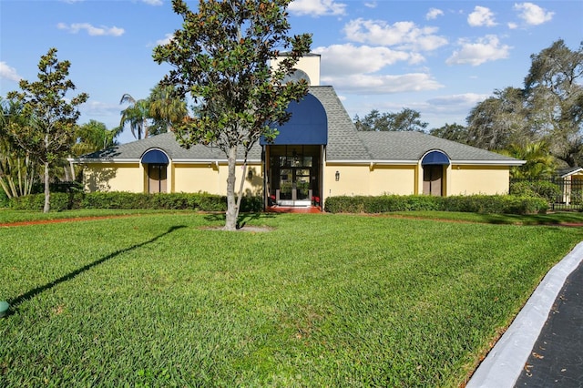 view of front of home featuring french doors and a front yard