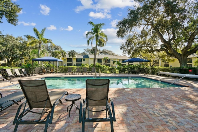 view of swimming pool featuring a patio