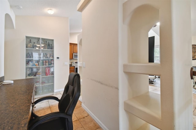 home office with light tile patterned floors