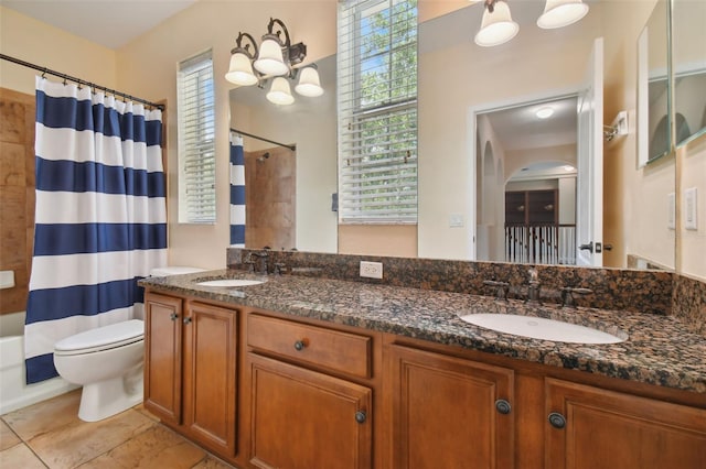 full bathroom with shower / bath combo with shower curtain, tile patterned flooring, vanity, and toilet