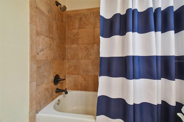 bathroom with shower / tub combo with curtain