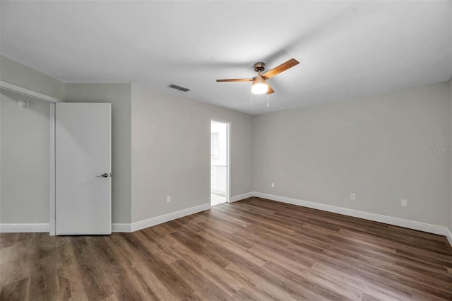 interior space with dark hardwood / wood-style floors and ceiling fan