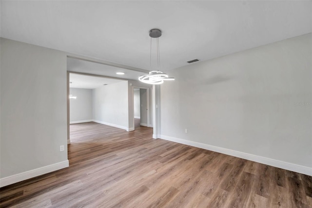 unfurnished dining area with wood-type flooring