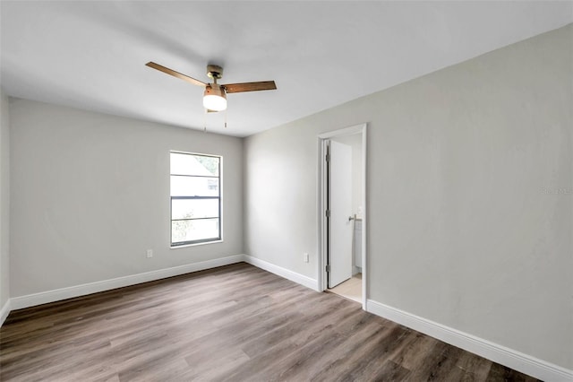 empty room with light hardwood / wood-style flooring and ceiling fan